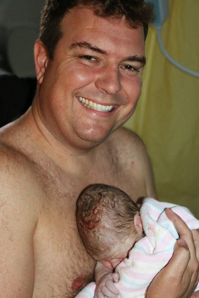 Man holding new born baby, Rachel Campbell's birth story