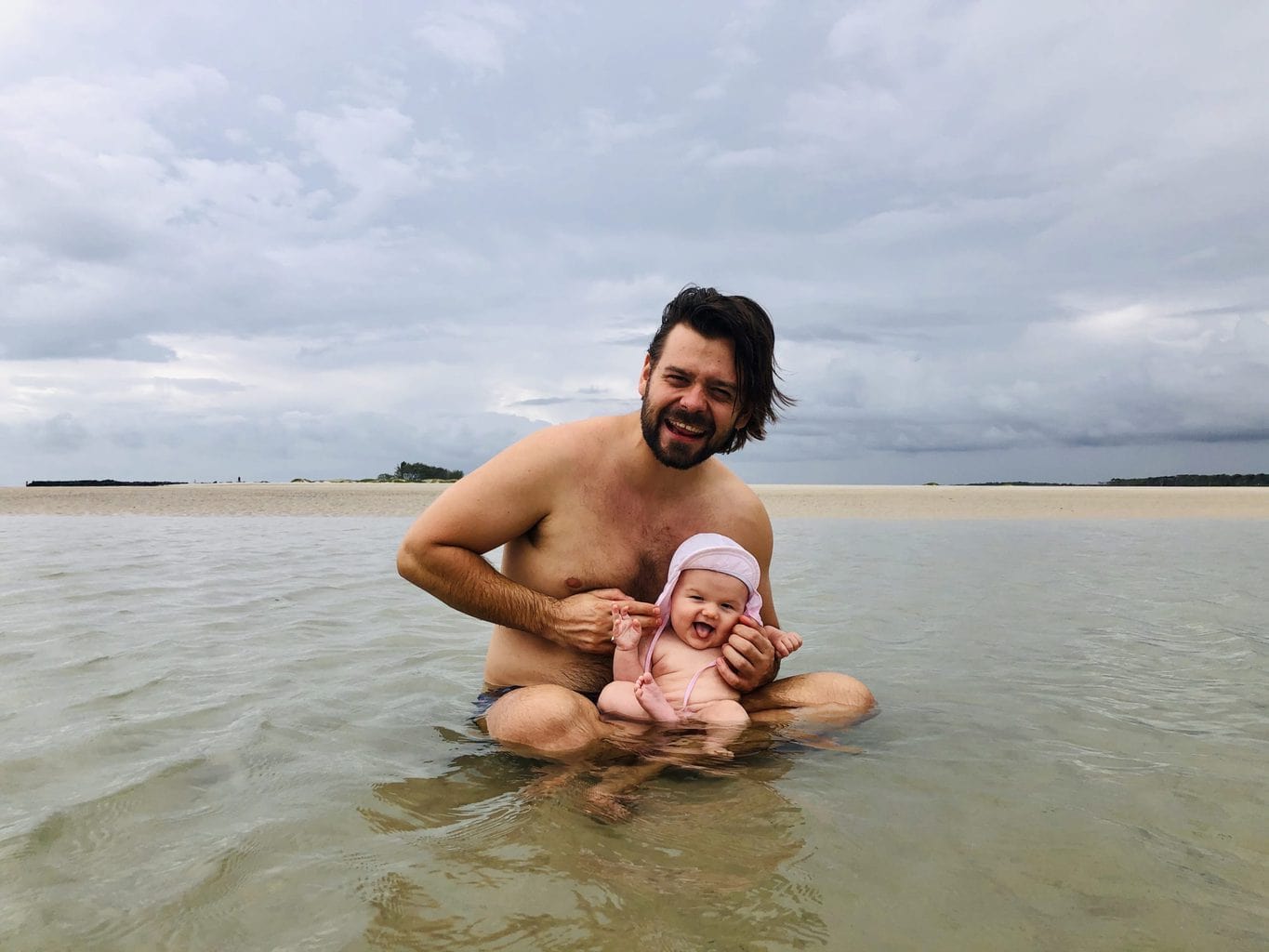 jordan and baby in ocean